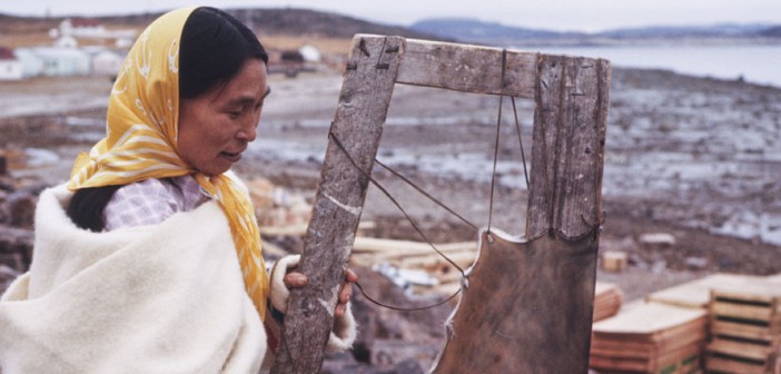 Inuit woman stretching a seal skin on a frame, circa 1961 (photo credit: Library and Archives Canada, used under CC BY-NC-ND 2.0)