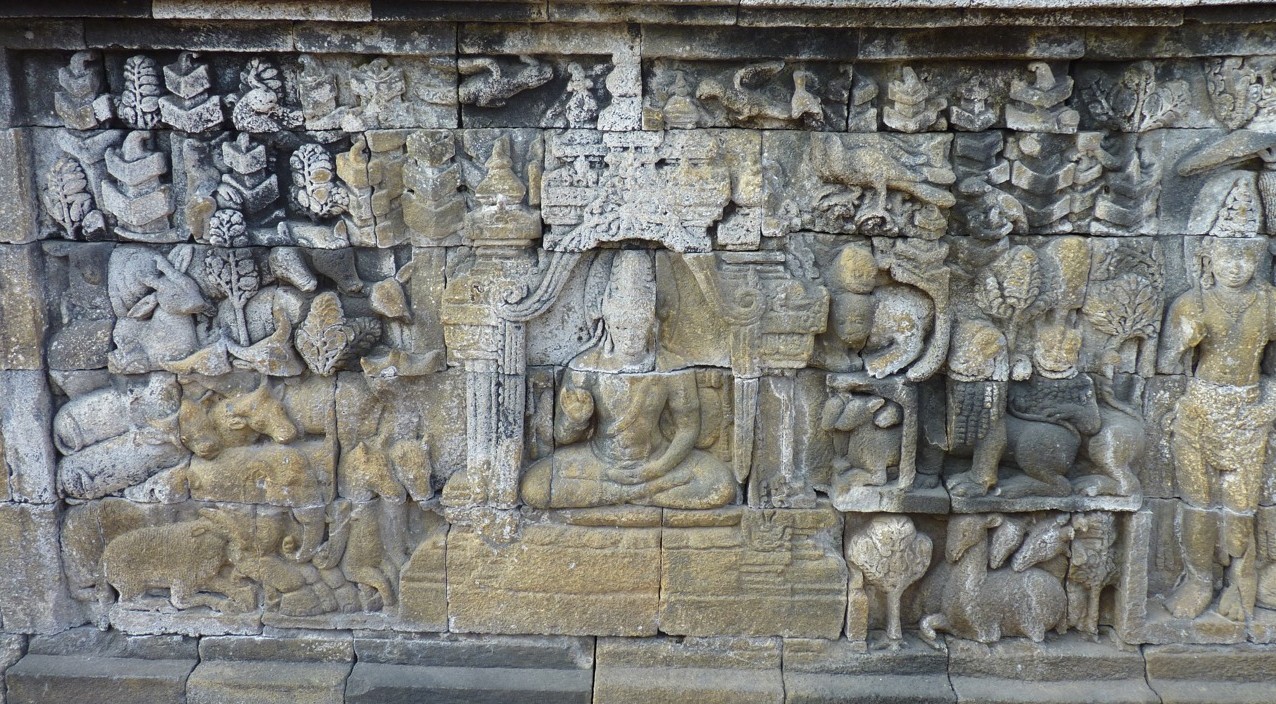 Carving of the Buddha surrounded by animals in Borobudur Temple, Java (photo credit: Wolf Clifton - Animal People, Inc.)